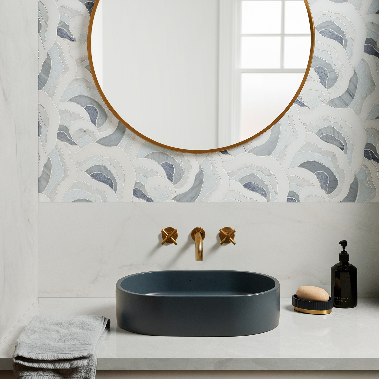 green tiles in a minimalist ktichen. tea is on the counter, as well as a cutting board and sliced lemons.